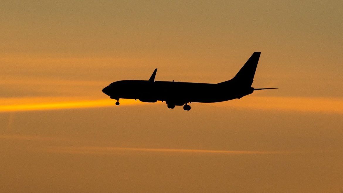 Aircraft Landing at Sunset