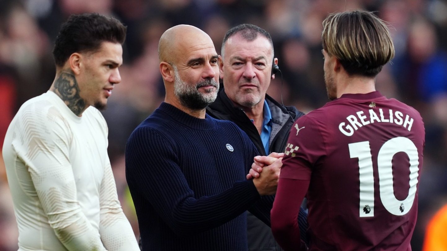 Pep Guardiola and Jack Grealish