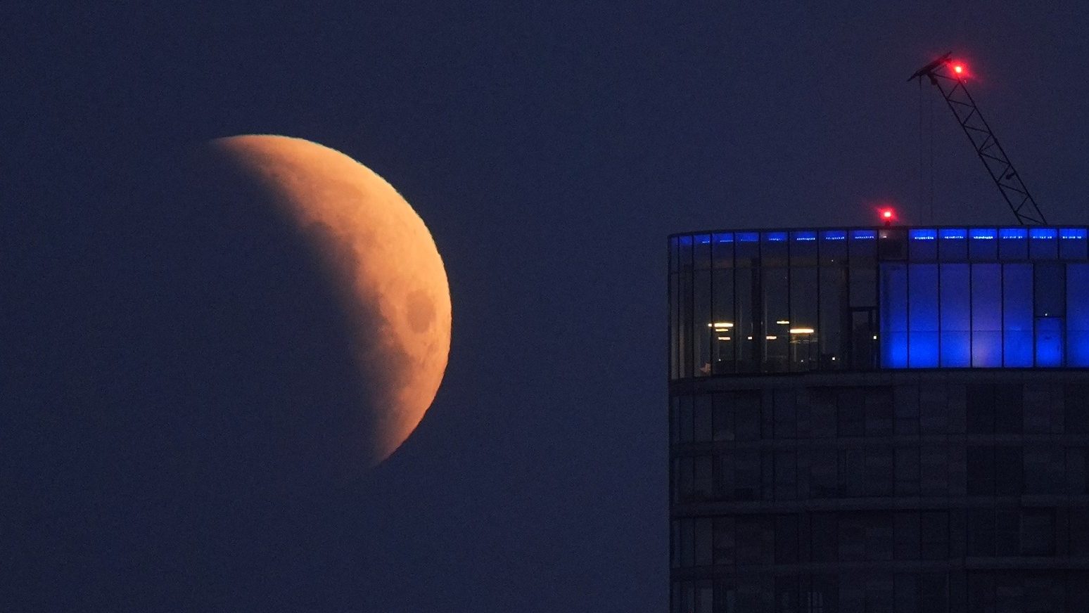 UK stargazers wake up to rare ‘blood moon’ partial lunar eclipse