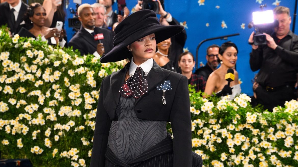 Rihanna debuts baby bump on star-studded Met Gala blue carpet