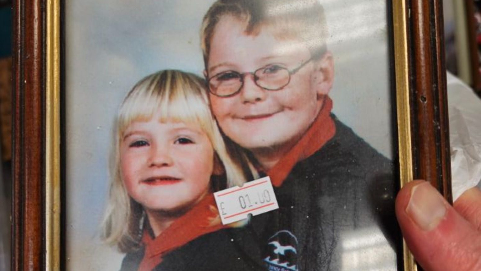 Siblings reunited with school photo found in charity shop 300 miles away