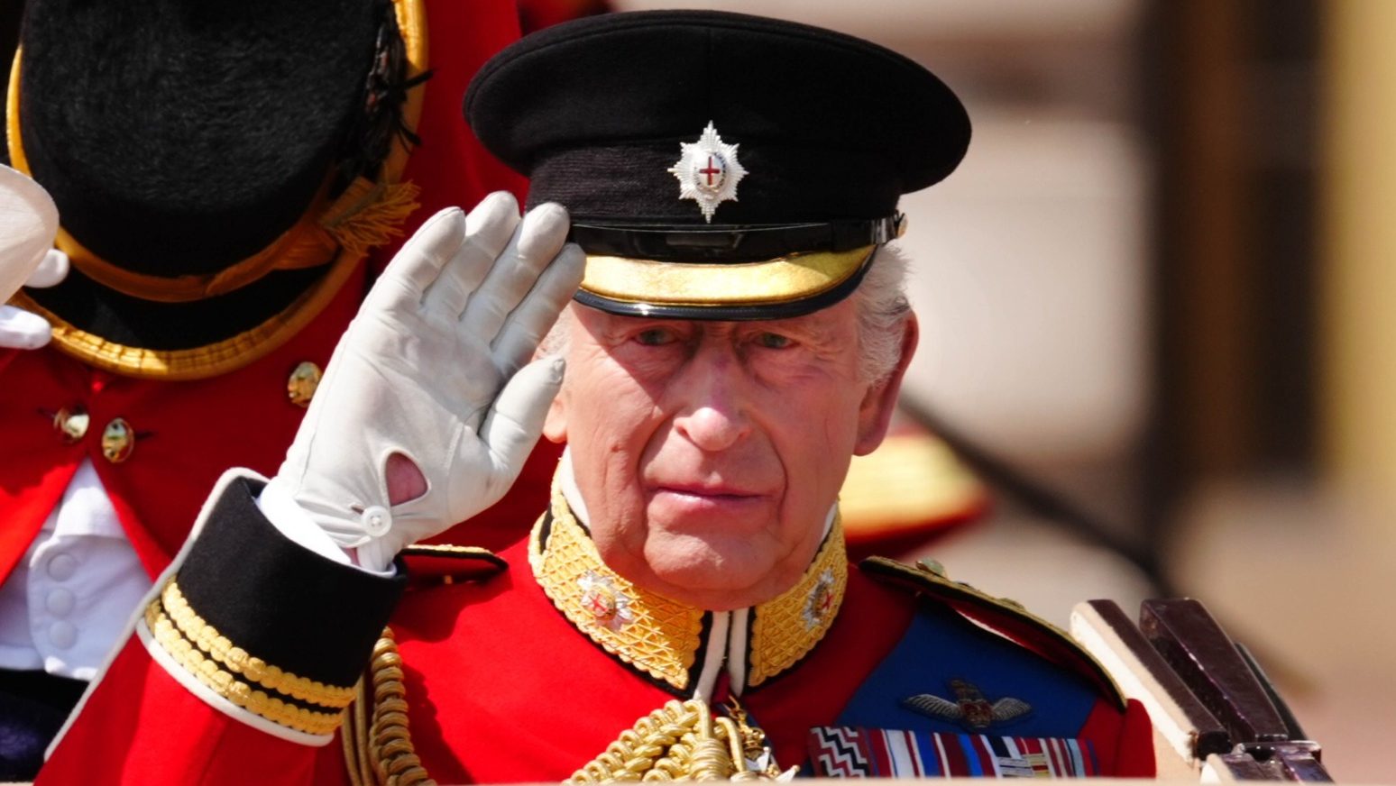 King wears black armband in memory of India air disaster at Trooping the Colour