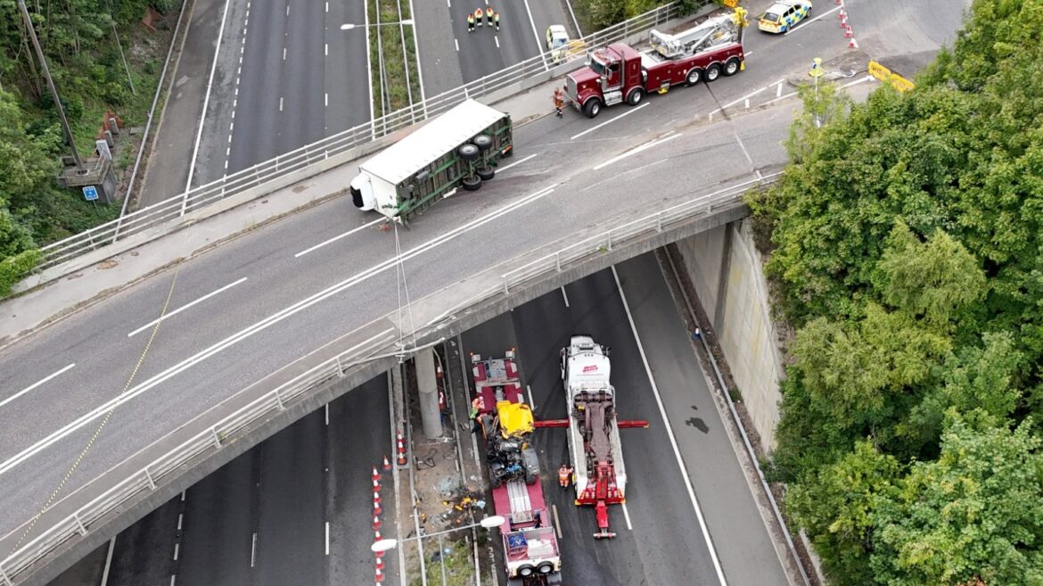 Man seriously injured after tractor falls onto motorway from bridge